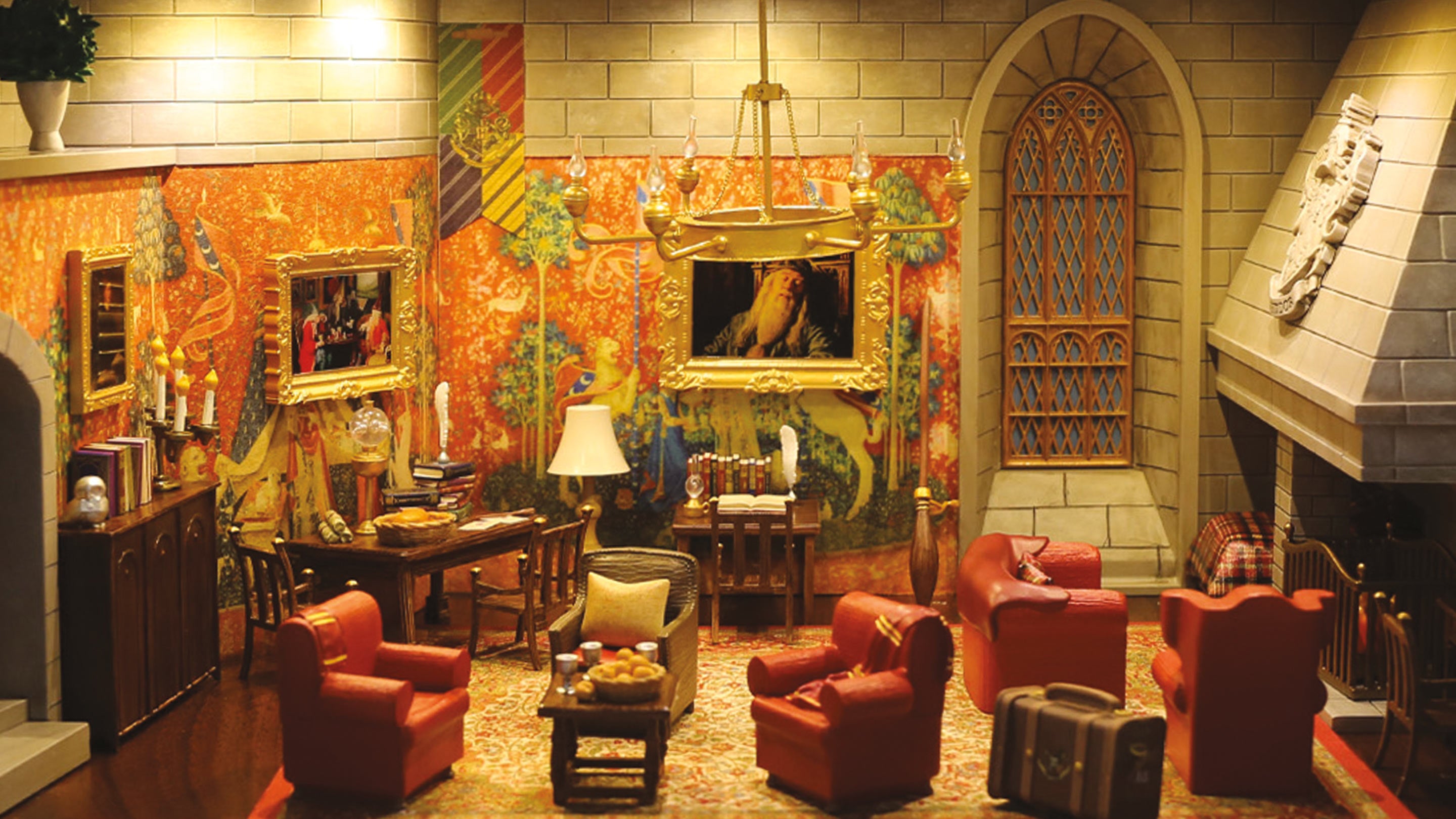 Decorative interior with red chairs, a table, and colorful walls.