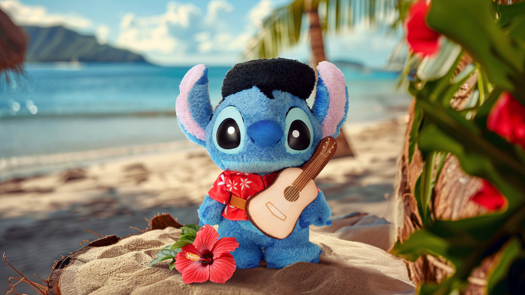 Plush toy resembling a character with a guitar on a beach setting